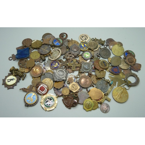 901 - A collection of fobs, medallions, etc.