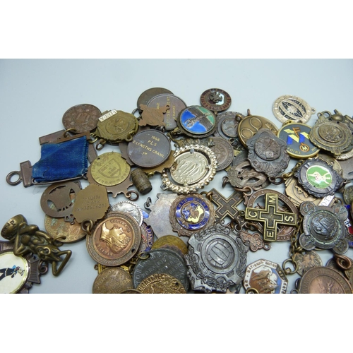 901 - A collection of fobs, medallions, etc.