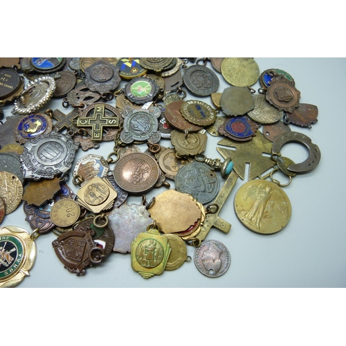 901 - A collection of fobs, medallions, etc.