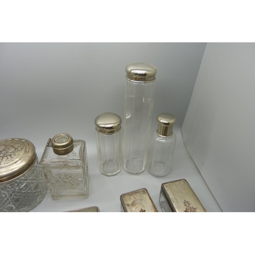 911 - Vanity jars including one silver topped, brushes, etc.