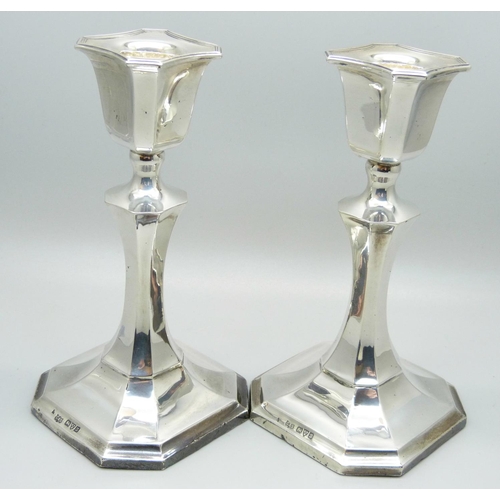 913 - A pair of silver candlesticks, 14.5cm