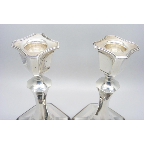 913 - A pair of silver candlesticks, 14.5cm