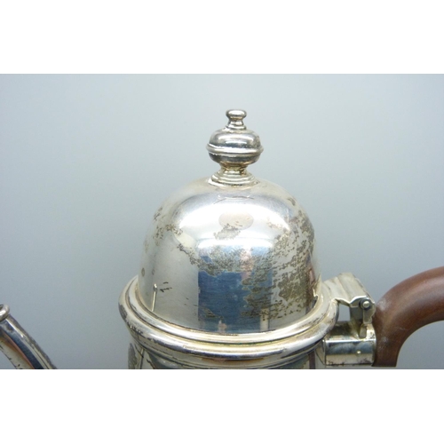 920 - A silver coffee pot with wooden handle, 742g