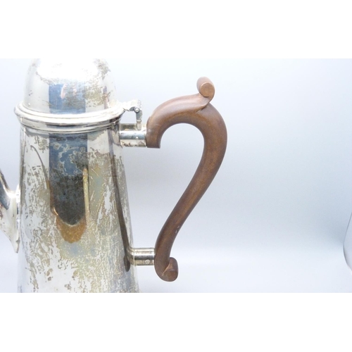 920 - A silver coffee pot with wooden handle, 742g