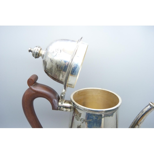 920 - A silver coffee pot with wooden handle, 742g