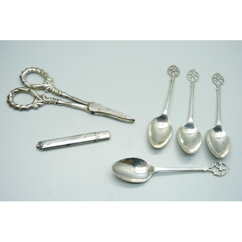 921 - A silver trophy, silver handled grape scissors, silver coffee spoons and a silver pencil holder