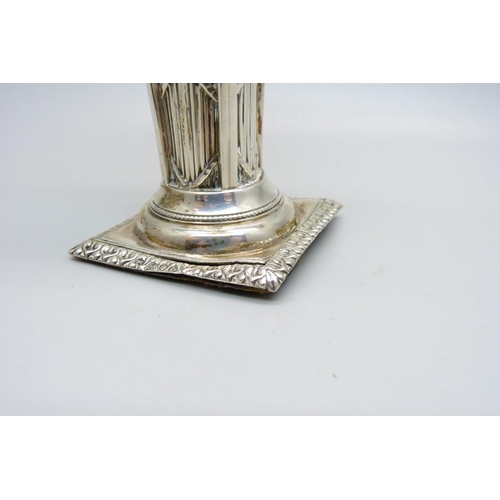 923 - A white metal Corinthian column candlestick, 11cm with stopper