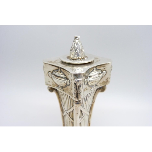 923 - A white metal Corinthian column candlestick, 11cm with stopper