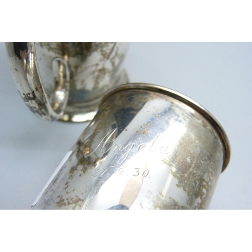 927 - A silver mug, with 'Peter' inscription and one other silver mug, handle a/f, 165g