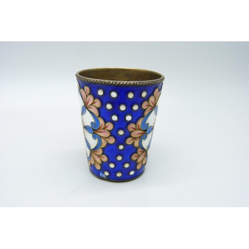 930 - A Russian silver and enamel vodka cup, 40g