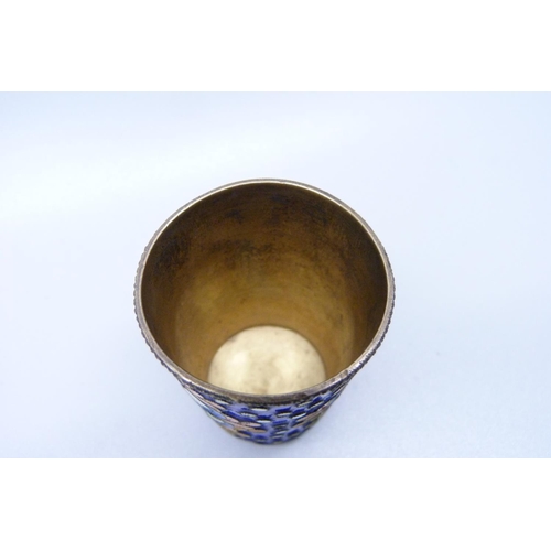 930 - A Russian silver and enamel vodka cup, 40g