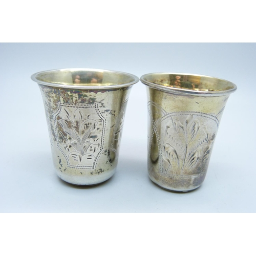 933 - Two Russian silver vodka cups, 24g and 18g