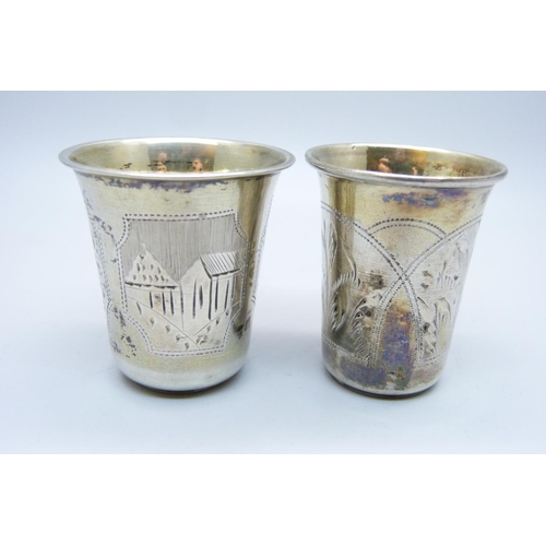 933 - Two Russian silver vodka cups, 24g and 18g