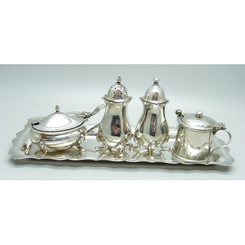 937 - Four silver condiments and a silver tray, 264g