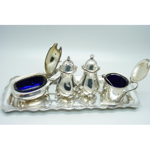 937 - Four silver condiments and a silver tray, 264g