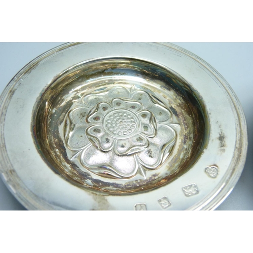 943 - A small plated dish with Mother Theresa coin inset and a silver Yorkshire Rose dish, 97g