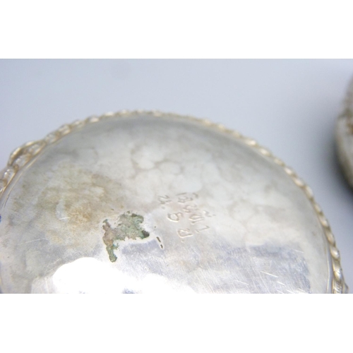 947 - A pair of African white metal embossed bowls, decorated with African wild animals, 144g