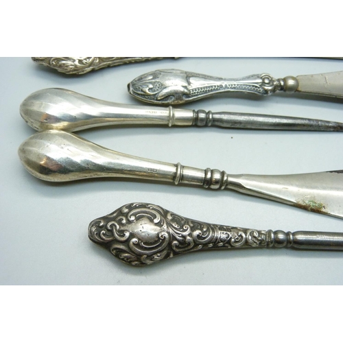 951 - A bag of seven silver handled tools