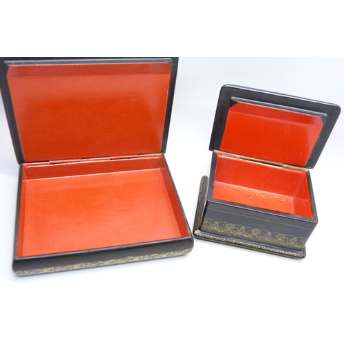 957 - Two Russian lacquered boxes with hand painted lids, both signed