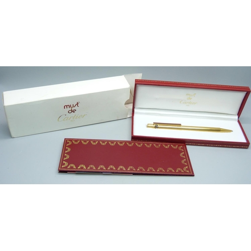 963 - A Must de Cartier rolled gold ballpoint pen, boxed