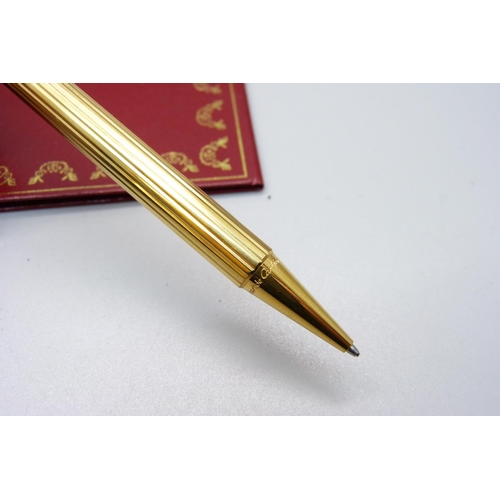 963 - A Must de Cartier rolled gold ballpoint pen, boxed