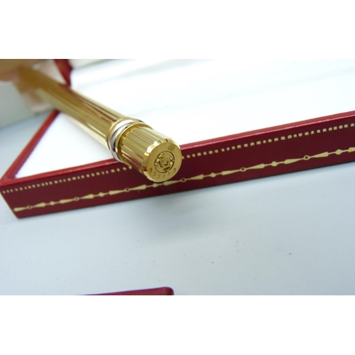 963 - A Must de Cartier rolled gold ballpoint pen, boxed