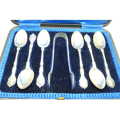 964 - A cased set of six silver spoons and sugar bows, 113g