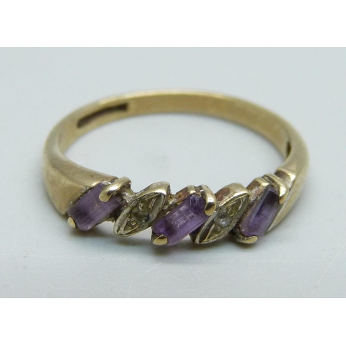 973 - A 9ct gold, amethyst and diamond ring, 1.8g, P