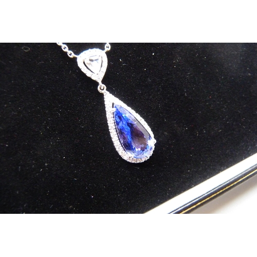 994 - An 18ct white gold, 5.2ct tanzanite and diamond necklace with Anchor Cert Gem Lab report, total weig... 