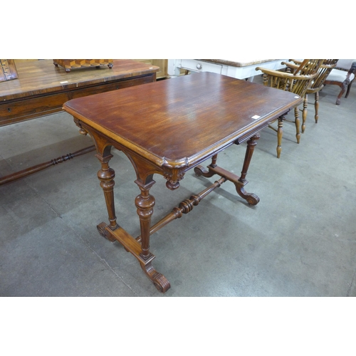 10 - A Victorian style hardwood two drawer stretcher table