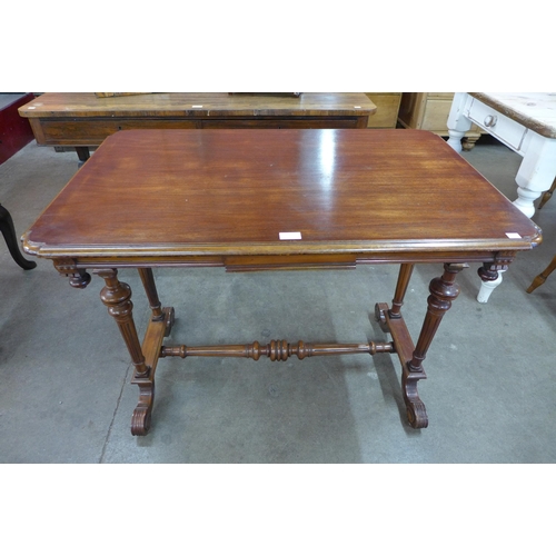 10 - A Victorian style hardwood two drawer stretcher table