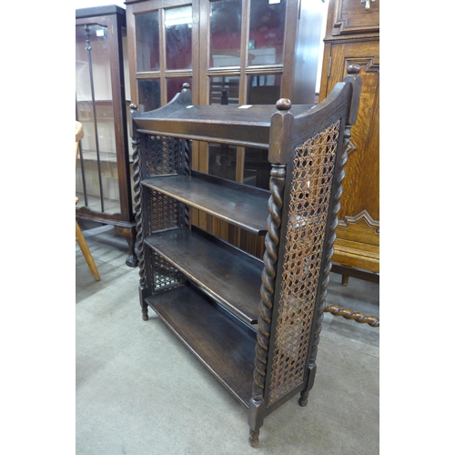 101 - An early 20th Century oak bergere open bookcase