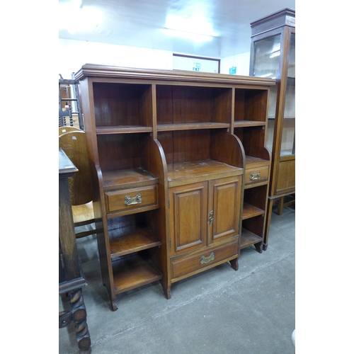 111 - A Victorian walnut breakfront open bookcase, manner of James Schoolbred