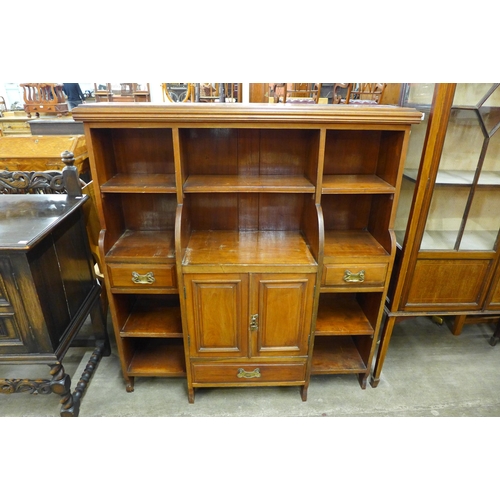 111 - A Victorian walnut breakfront open bookcase, manner of James Schoolbred