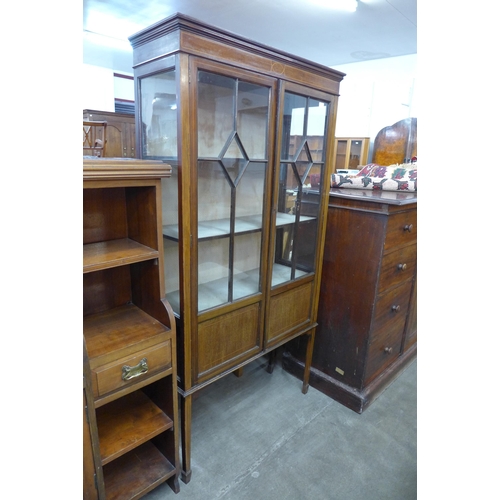 112 - An Edward VII inlaid mahogany two door display cabinet