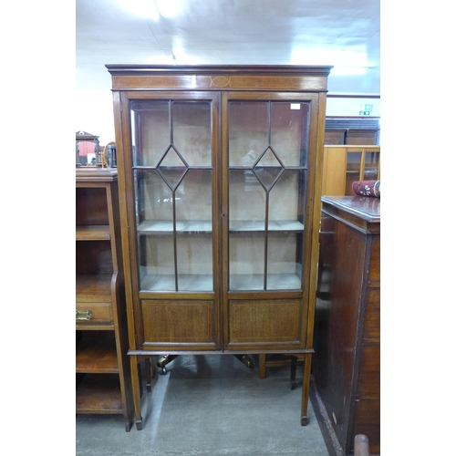 112 - An Edward VII inlaid mahogany two door display cabinet