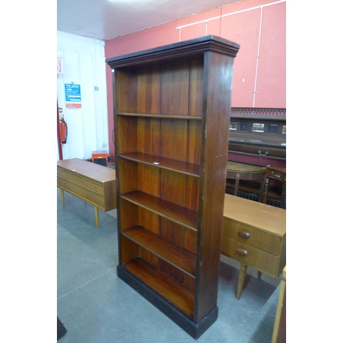 114 - A tall Victorian mahogany open bookcase