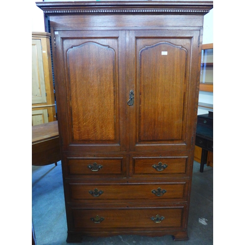 119 - A George III style Warings oak linen press