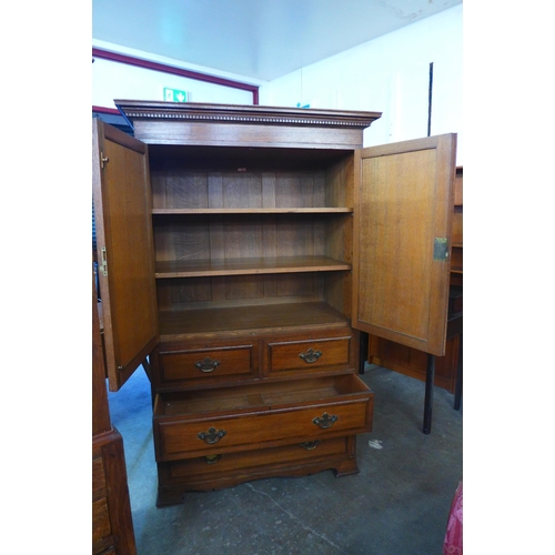 119 - A George III style Warings oak linen press