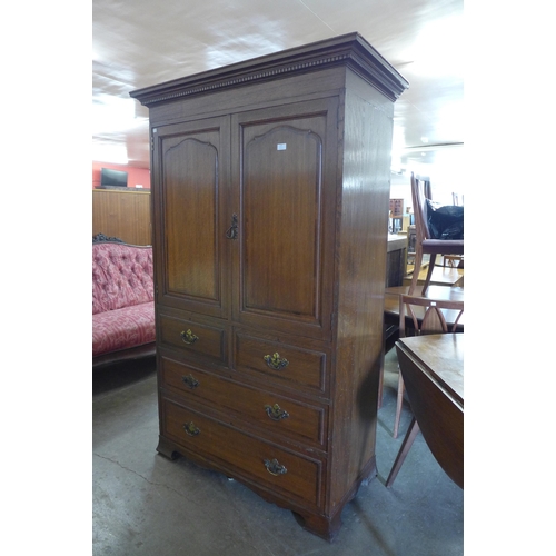 119 - A George III style Warings oak linen press