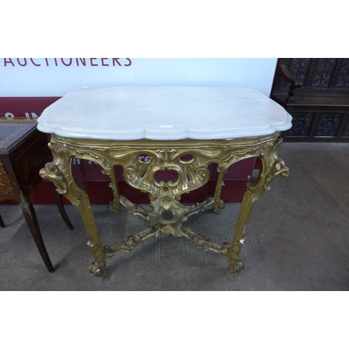 13 - An Italian Rococo style carved giltwood, gesso and marble topped console table