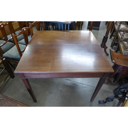 152 - A George III mahogany rectangular fold over tea table