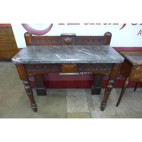 16 - A Victorian carved mahogany and marble topped console table, made by Widger of Plymouth