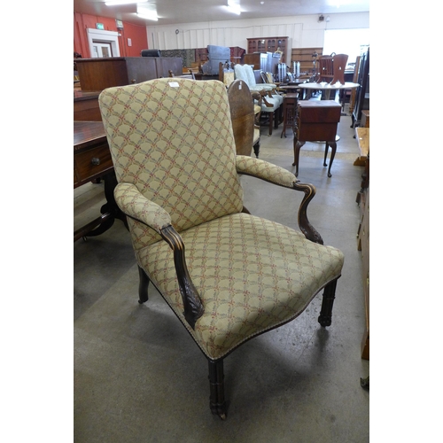 169 - A 19th Century Chippendale style carved mahogany and fabric upholstered armchair