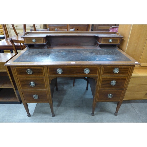 173 - A late Victorian Warings inlaid mahogany desk