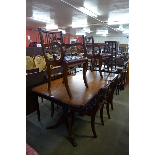 176 - A Regency style mahogany extending dining table and six chairs