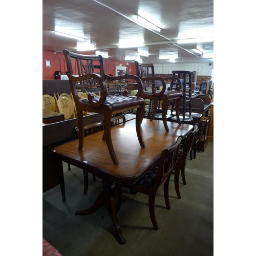 176 - A Regency style mahogany extending dining table and six chairs