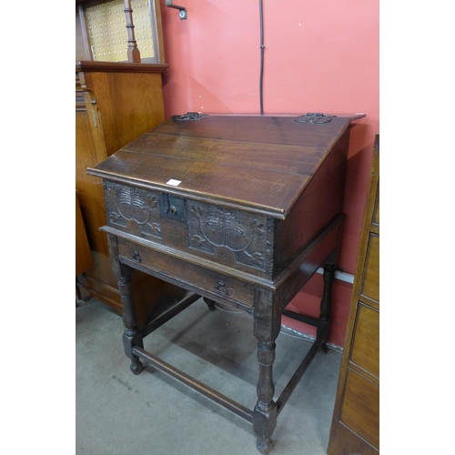 19 - A William III carved oak Bible box on stand