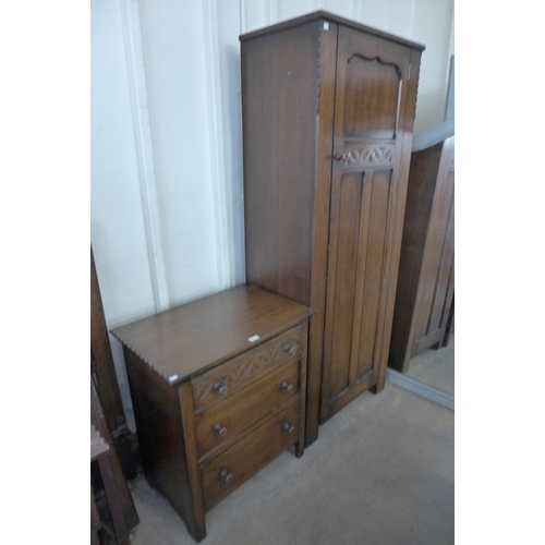 194 - A carved Ipswich oak four piece bedroom suite, comprising; single door wardrobe, chest of drawers, d... 