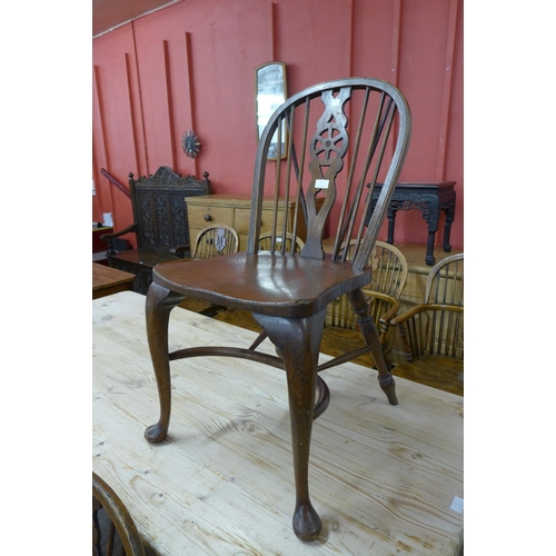 2 - A set of George III style oak wheelback Windsor kitchen chairs